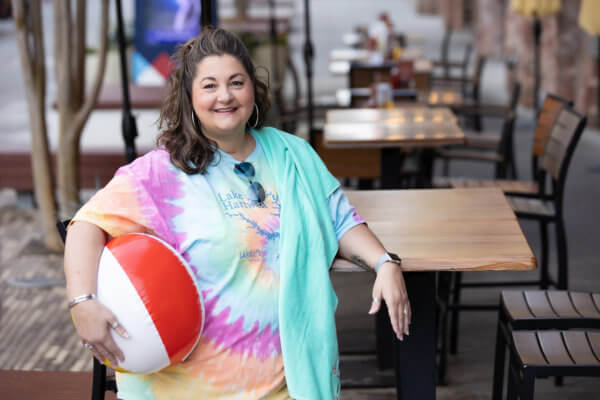 Alissa Hawkins standing next to a table with beach ball.