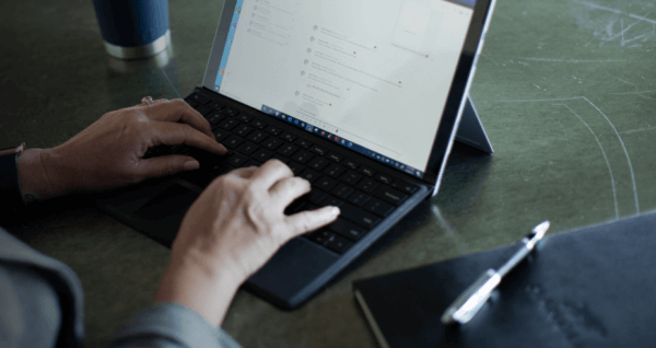 Woman typing on her laptop computer