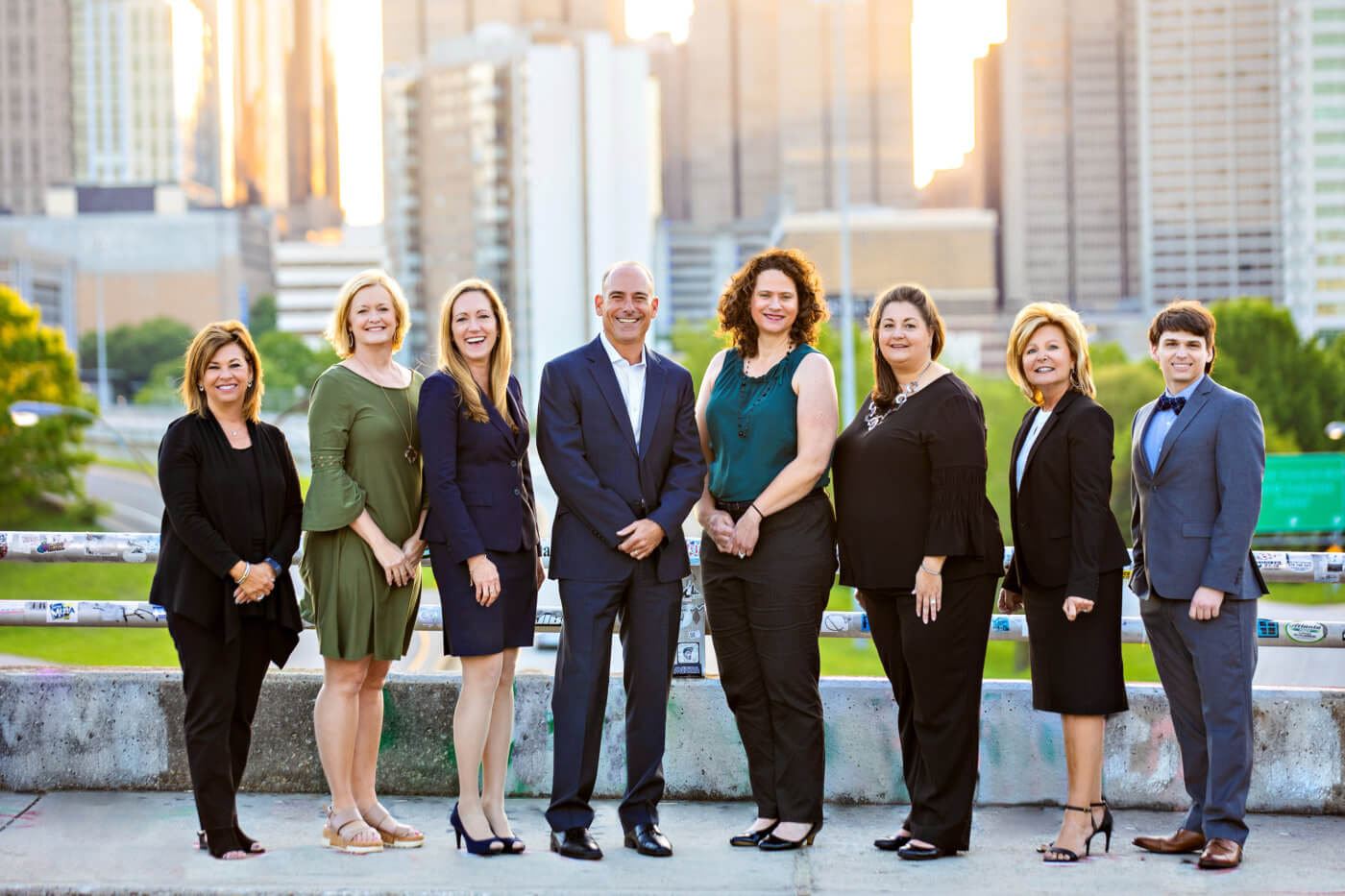 Team Handler standing on a bridge overlooking the Atlanta skyline. Handler Handler serves an exclusive list of Atlanta’s corporations including Fortune 500, mid-sized, and emerging private companies by supporting our brand promise of delivering Leaders Worth Following.