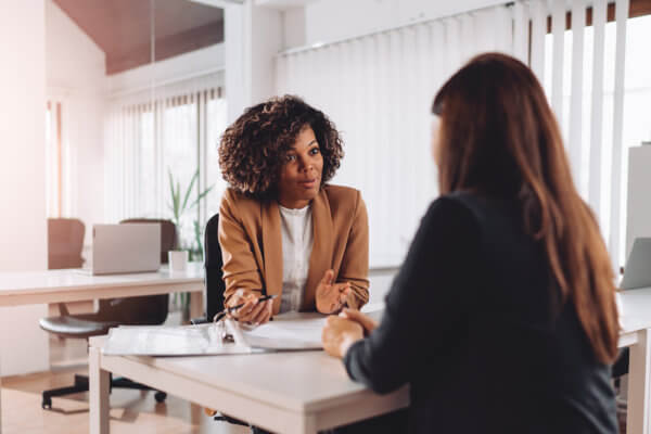 Woman hiring in Q4 has an interview across the table from a candidate