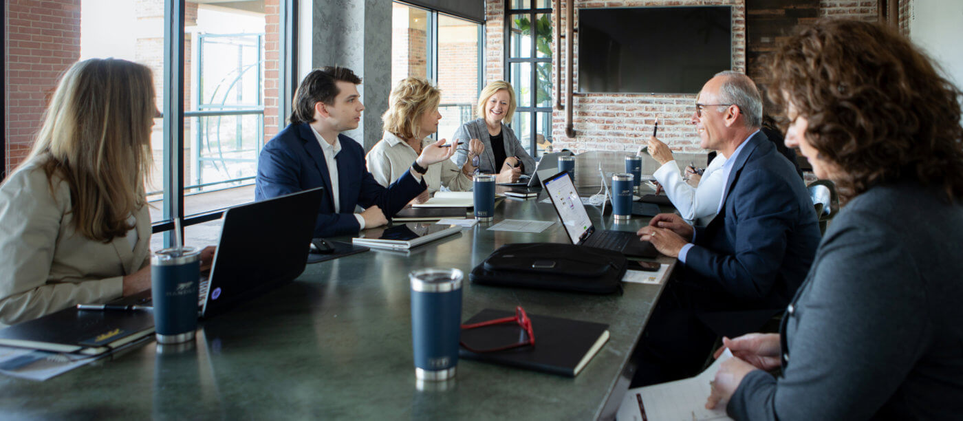 Team Handler talking at a desk about recruiting in Atlanta