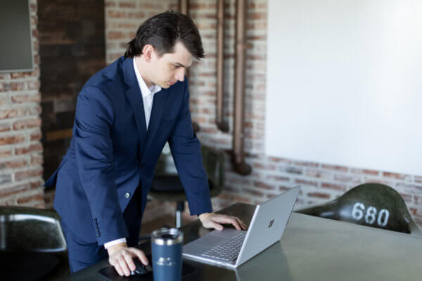 Man looking at computer - What Transformation Means to Top Talent