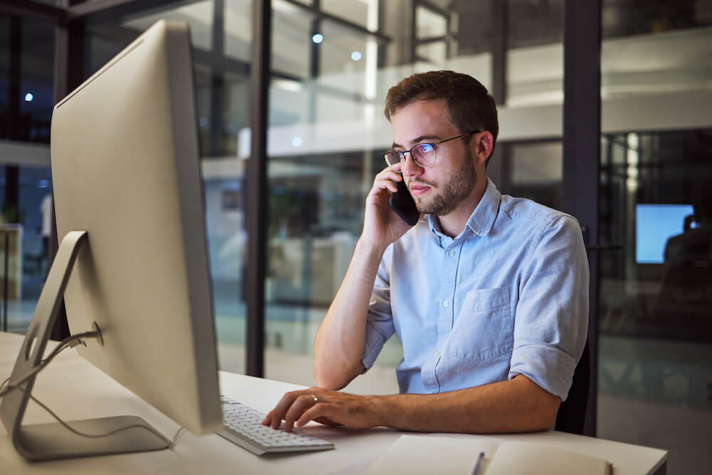 Candidate on the phone while looking at computer screen