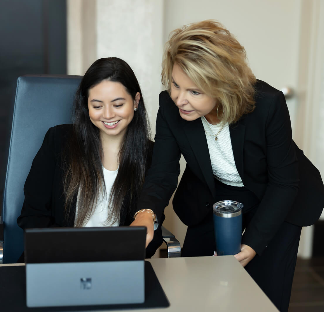 Handler team working together on the laptop computer