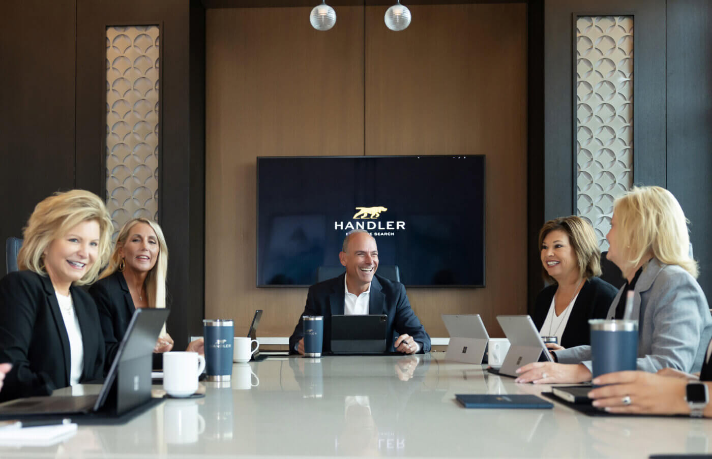 Handler team at the conference table