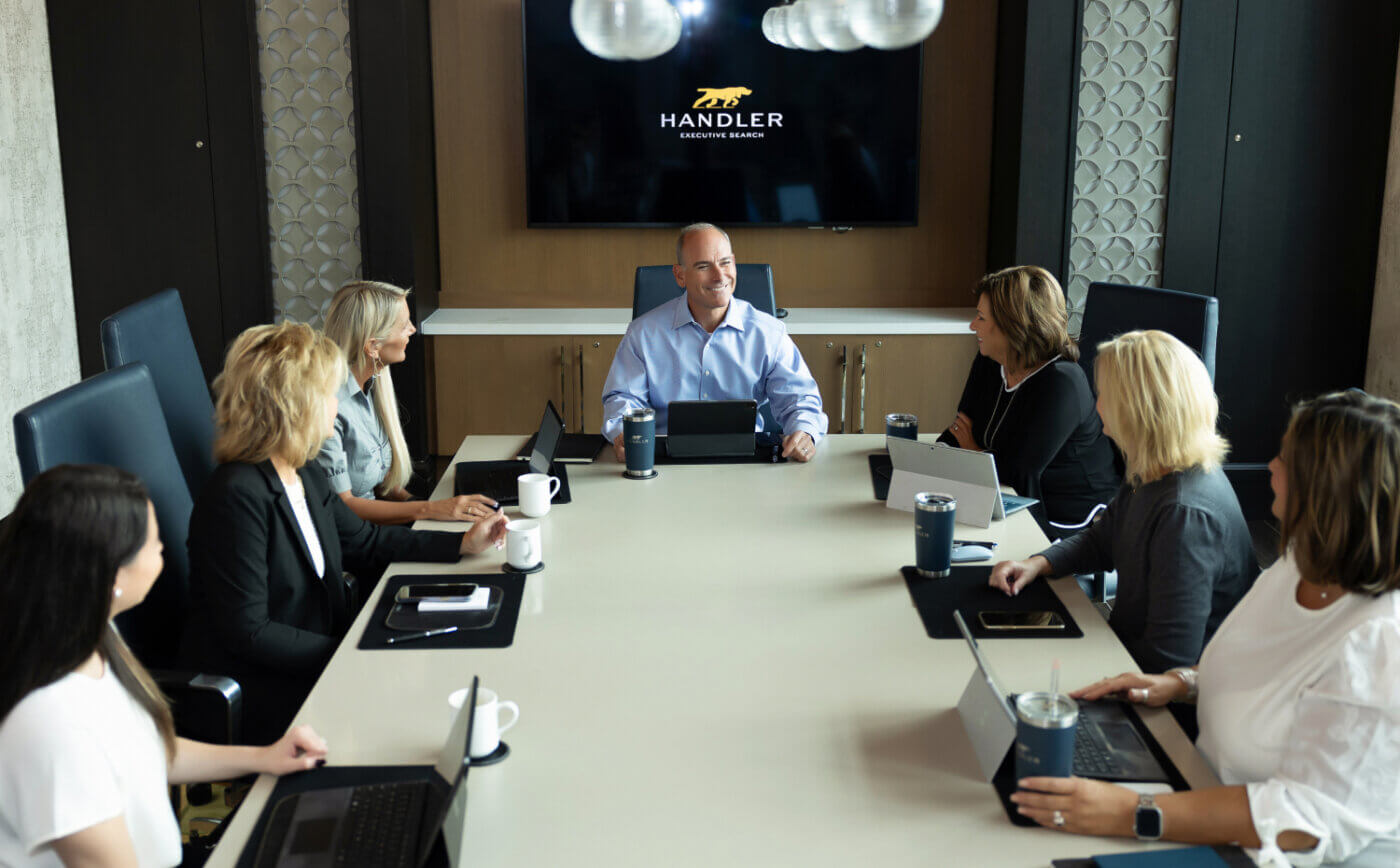 Handler team at the conference Table